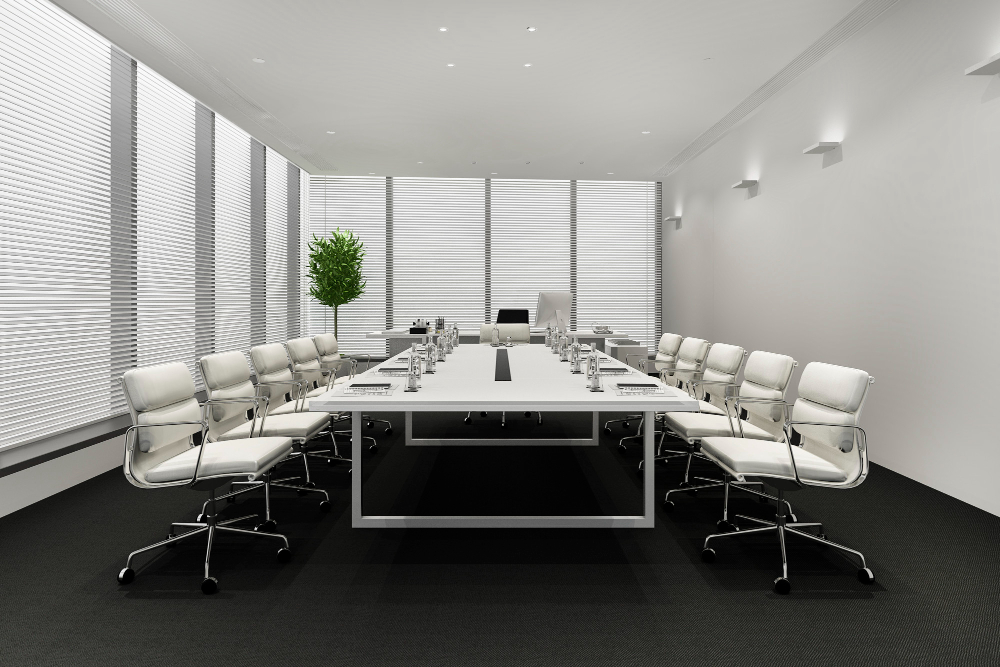 Bright meeting room with a long table and chairs